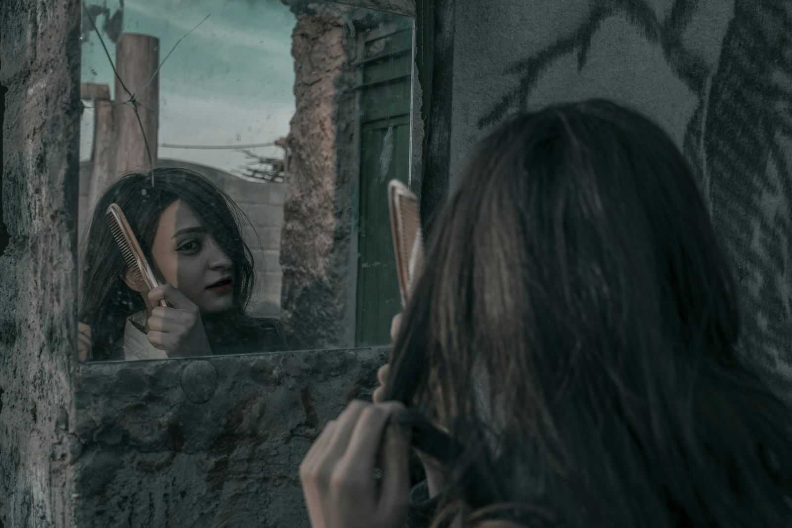 woman combing her hair